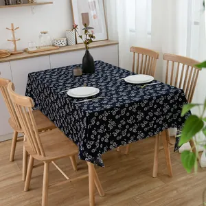 Macro detail of navy blue batik style floral cotton linen tablecloth for dining room