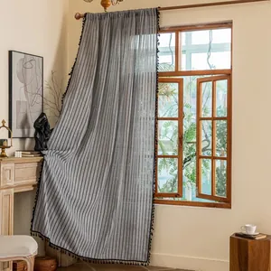 Modern grey vertical stripe curtains with black tassel trim for elegant living room decor