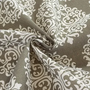 Detail of vintage Baroque damask patterns on olive taupe cotton linen fabric texture