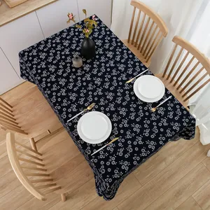 Close-up of deep blue cotton linen tablecloth with white floral batik patterns