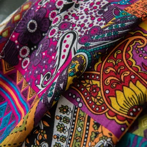 Close-up of bohemian sunflower print on thick cotton linen fabric with paisley patterns