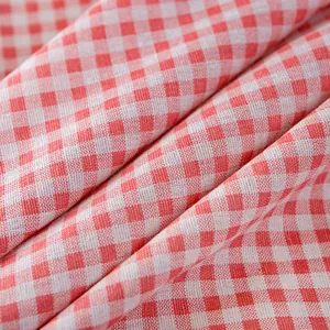 Pink and white gingham cotton tablecloth with classic printed pattern and soft fringes