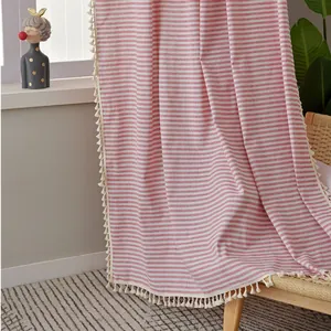 Red and white striped linen curtain with elegant cream tassels for rustic home decor