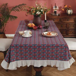 Vintage floral rectangle tablecloth with ruffle edges in a cozy dining setting