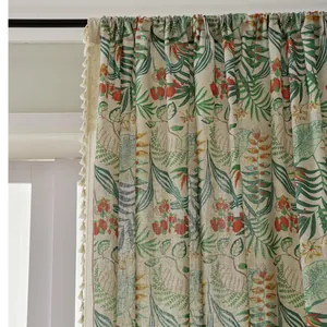 Linen blend tropical leaf curtain with green botanical prints and beige fringe trim