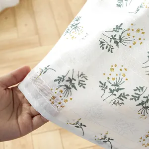 Pastel floral embroidery on white cotton linen rectangular tablecloth with tassels