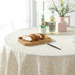 Floral cotton linen round tablecloth featuring yellow daisy patterns and white base color