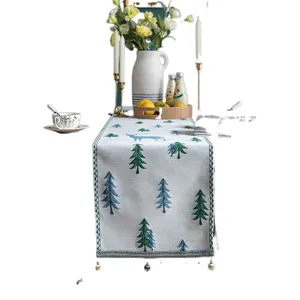 Christmas table runner with embroidered forest reindeer and pine trees with tassels