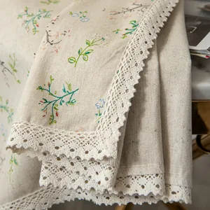 Detailed macro view of cotton linen sunflower fabric with delicate lace trim and floral pattern