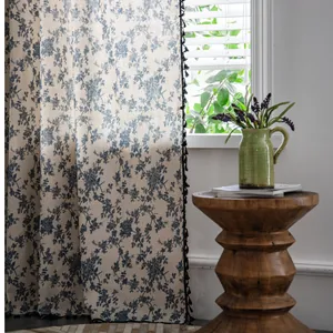 Rustic cotton linen curtain with blue floral toile pattern and black fringe tassels