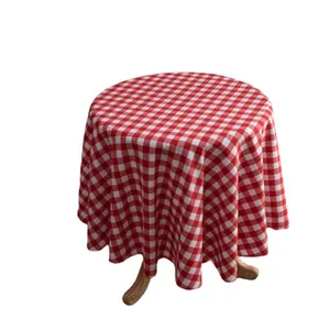 Classic red and white gingham round tablecloth with elegant drape for festive dining decor