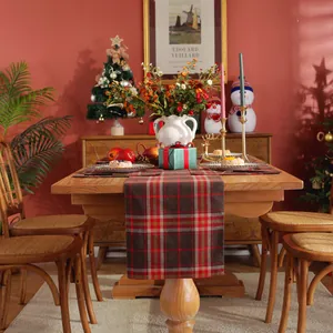 Detailed view of red and green plaid Christmas table runner with thick woven texture