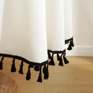 Mantel minimalista de algodón y lino crema con borlas negras decorativas de calidad