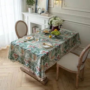 Tropical palm leaf tablecloth with red floral pattern and elegant tassel edges