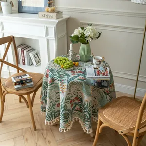 Tovaglia rotonda vintage con stampe di foglie di palma verdi e bordi con nappe bianche