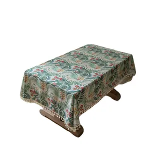 Rectangular cotton linen tablecloth with tropical green leaf prints and beige tassels