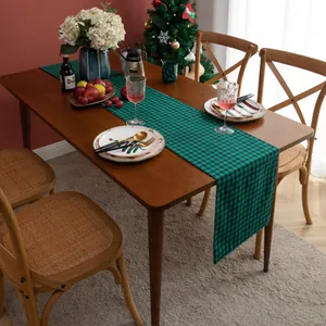 Close-up of green and black plaid table runner for festive Christmas dining decor