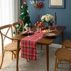 Close-up of red plaid cotton linen table runner with classic festive Christmas pattern