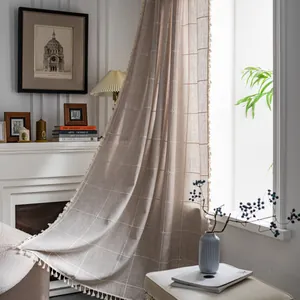 Linen texture plaid curtain with white tassel fringe in a soft beige neutral tone