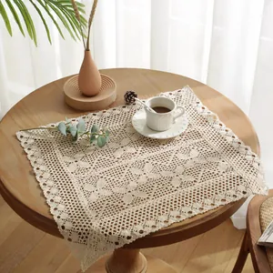 French retro style cream crochet lace tablecloth with hollow design on round wooden table
