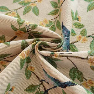 Detailed macro view of woven jacquard fabric with vintage floral and bird patterns