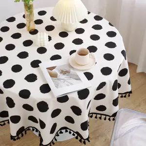 Mantel redondo de algodón y lino con lunares negros y borlas para comedor