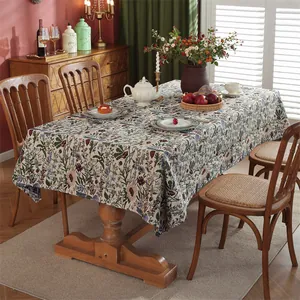 Close-up of vintage American floral tablecloth with detailed jacquard blue flower pattern