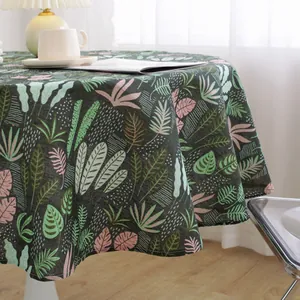 Nordic round tablecloth featuring tropical leaf patterns on premium linen fabric