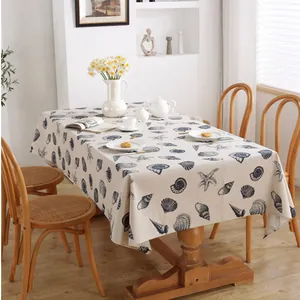 Linen rectangle tablecloth with Mediterranean blue shell and starfish print on wooden table