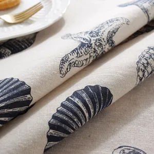 Detailed macro view of Mediterranean seashell print on linen blend tablecloth fabric