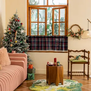 Close-up of vintage plaid curtain with white lace trim for Christmas home decoration