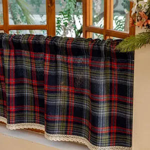 Detail of navy blue plaid cafe curtain with white lace edge and thick cotton texture