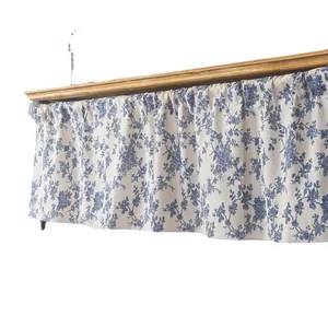 Short cafe curtain with blue floral print on cream fabric in a French country style