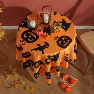 Orange Halloween round tablecloth featuring pumpkin and ghost patterns for festive dining