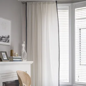 Modern white cotton linen sheer curtain with black wavy lace trim in minimalist room