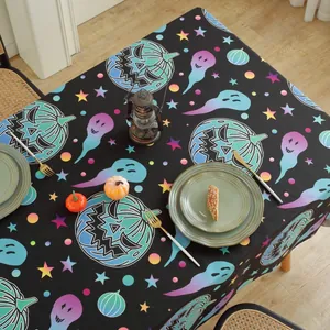 Halloween tablecloth with neon pumpkin and ghost patterns on black fabric for festive decor