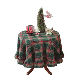 Round Christmas plaid tablecloth with ruffled edges and festive red green tartan pattern