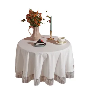 Elegant white round tablecloth featuring a decorative sheer striped mesh lace border edge