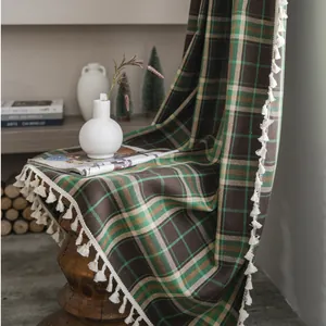 British style retro plaid throw blanket with white tassels on a wooden stool