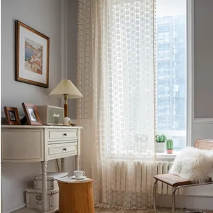 Beige crochet lace curtain with hollow flower pattern and small tassel ball fringe