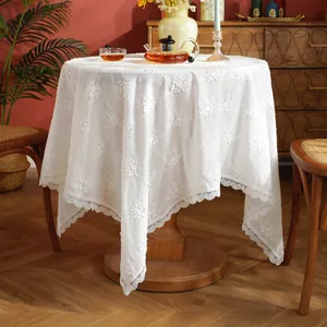 Elegant white round lace tablecloth with floral embroidery and scalloped edges