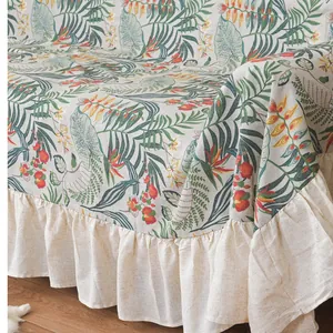 Tropical leaf print sofa cover with ruffled edges in cotton linen fabric