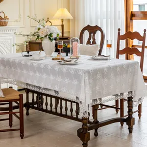 Elegant white French lace tablecloth with floral jacquard and romantic scalloped edges