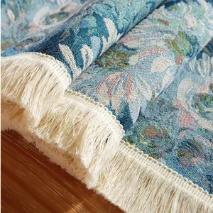 Close-up of jacquard sunflower table runner showing thick fabric texture and white tassels