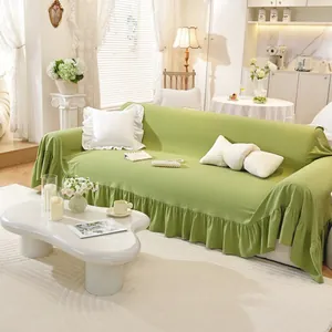Avocado green ruffle hem sofa cover in elastic knitted fabric for 3-seater couch decor