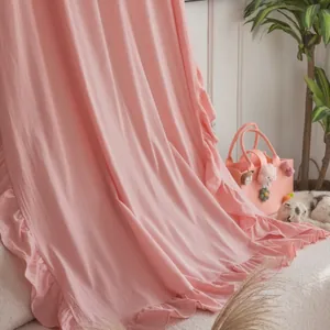 Detailed view of light pink fabric with soft ruffles and elegant texture for home decor