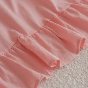 Pink princess style curtains with elegant ruffle edge detail and blackout fabric