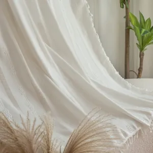 Boho beige hollow knit curtain with tassel detail and textured diamond weave pattern
