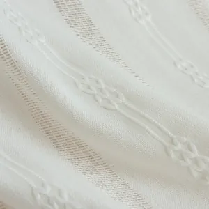White hollow jacquard cotton curtain with elegant tassel and textured weaving pattern
