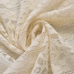 Close-up of beige lace fabric with hollow floral patterns for kitchen cabinet curtains